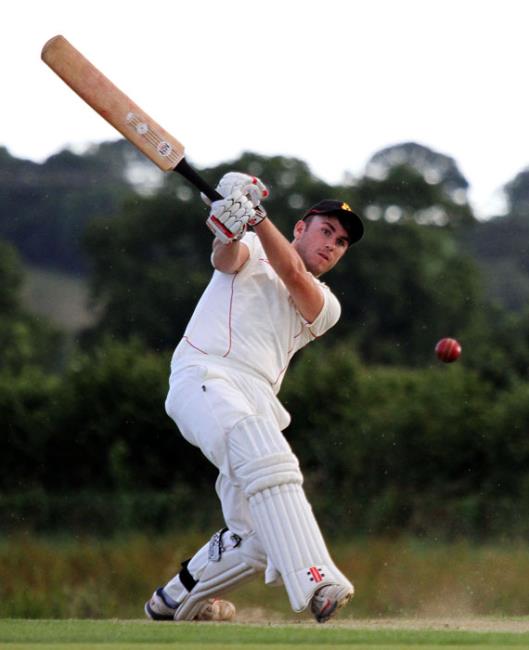 Tom Scourfield smashes a boundary for Carew